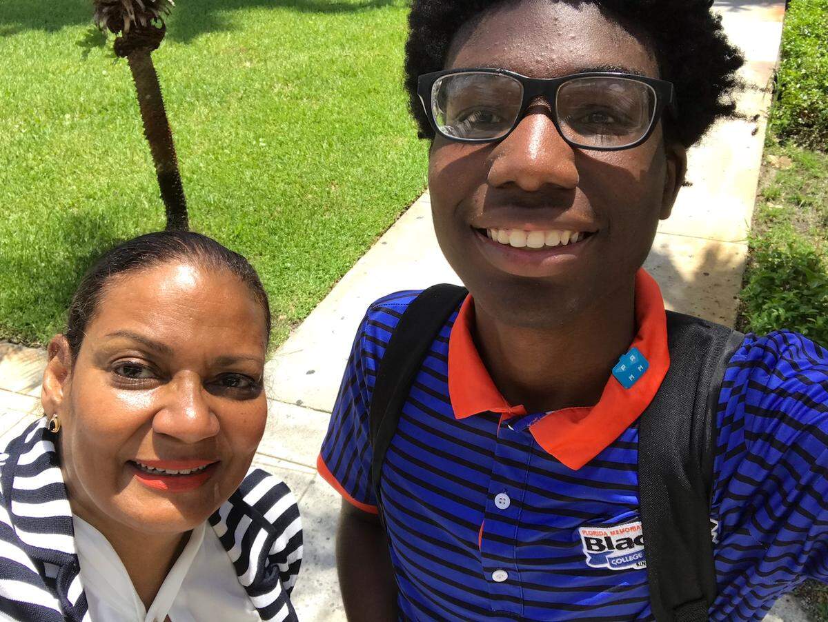 Opal Comfort, communications and marketing director at Florida Memorial University, takes a selfie with Black College Explorer Maurice Mays.