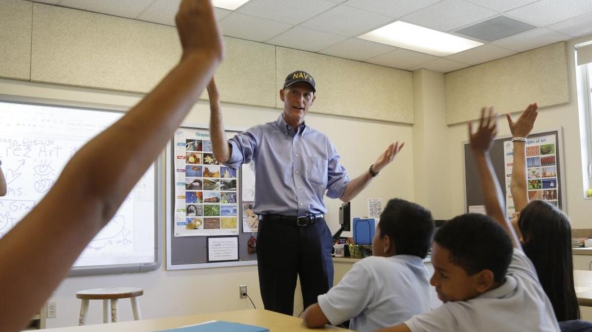 Florida Gov. Rick Scott speaks to a fifth grade class before holding a news conference with Alberto Carvalho, superintendent of Miami-Dade County Public Schools, at Southside Elementary School, Wednesday, Aug. 27, 2014, in Miami.