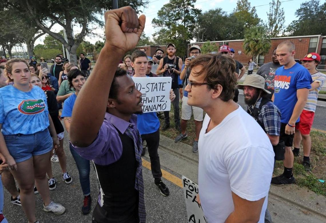 A man protesting Richard Spencer’s presence on the University of Florida campus faces off and sings in the face of an alt-right supporter near the Phillips Center where Spencer was allowed to speak on Oct. 19, 2017.