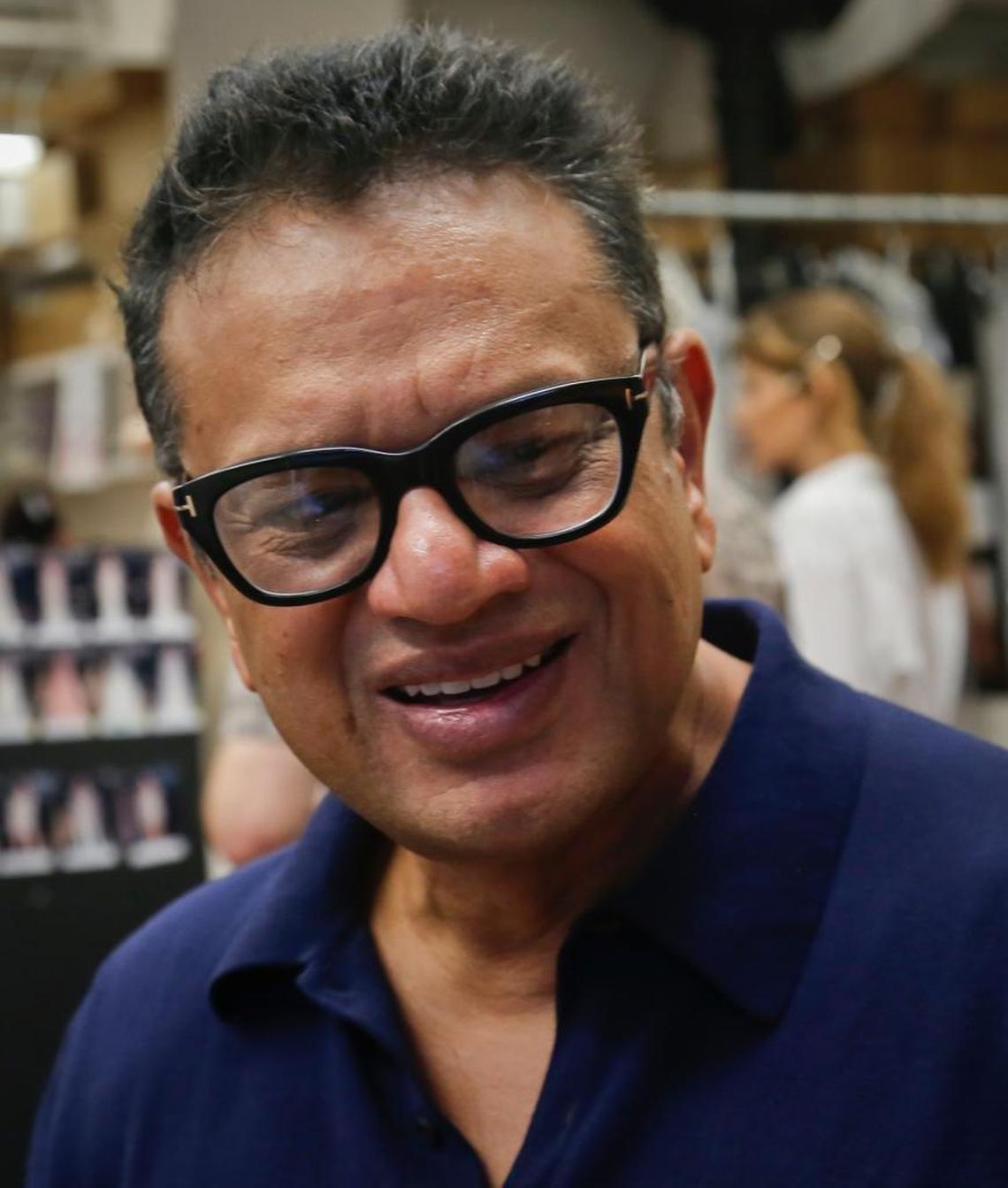 Naeem Khan speaks during a backstage interview before unveiling his bridal collection on Friday, Oct. 6, 2017, in New York.