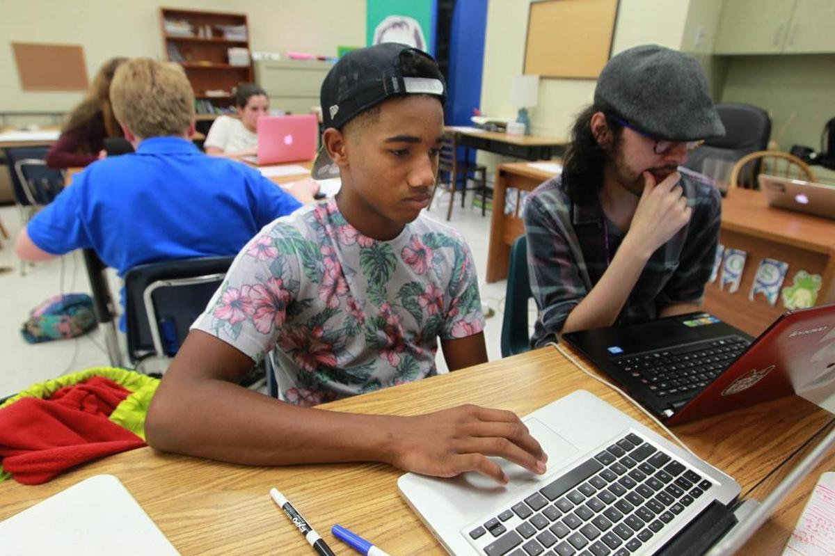 Zachri Hall, left, and Gabriel Sanchez study coding at a pre-college academy offered over the summer by Palmer Trinity School in Palmetto Bay, which teamed up with the Flatiron School.