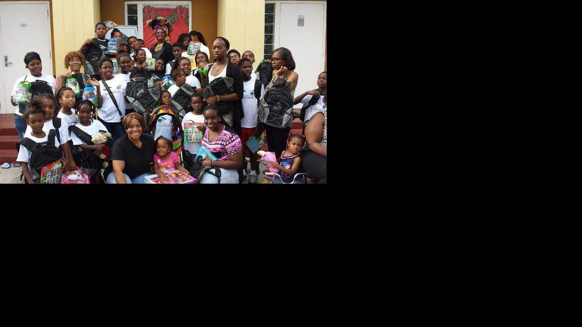 
CHRISTMAS TOY DRIVE: Miami-Dade School Board member Dorothy Bendross-Mindingall distributes toys and games at the Liberty Square Community Center for the Christmas season. Affordable Healthcare enrollment and health screenings were also available to the community. 
