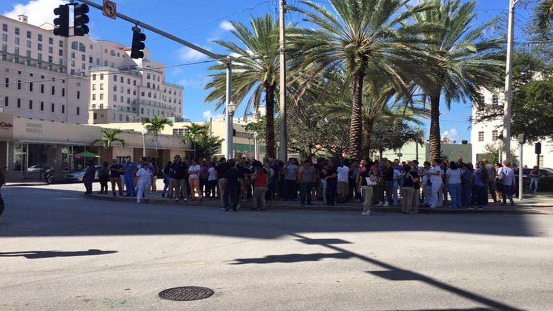Protesters gather near the corporate office of Dade Medical College on Monday. The school, which had six campuses around the state, closed on Friday.