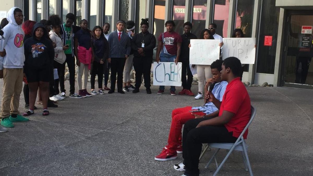 Miami-Dade students rally outside the School Board offices on Wednesday, October 18, 2017, to call for an end to out-of-school suspensions and sexual harassment at school. Two students, seated, share the story of a sixth grader suspended due to an off-campus fight.