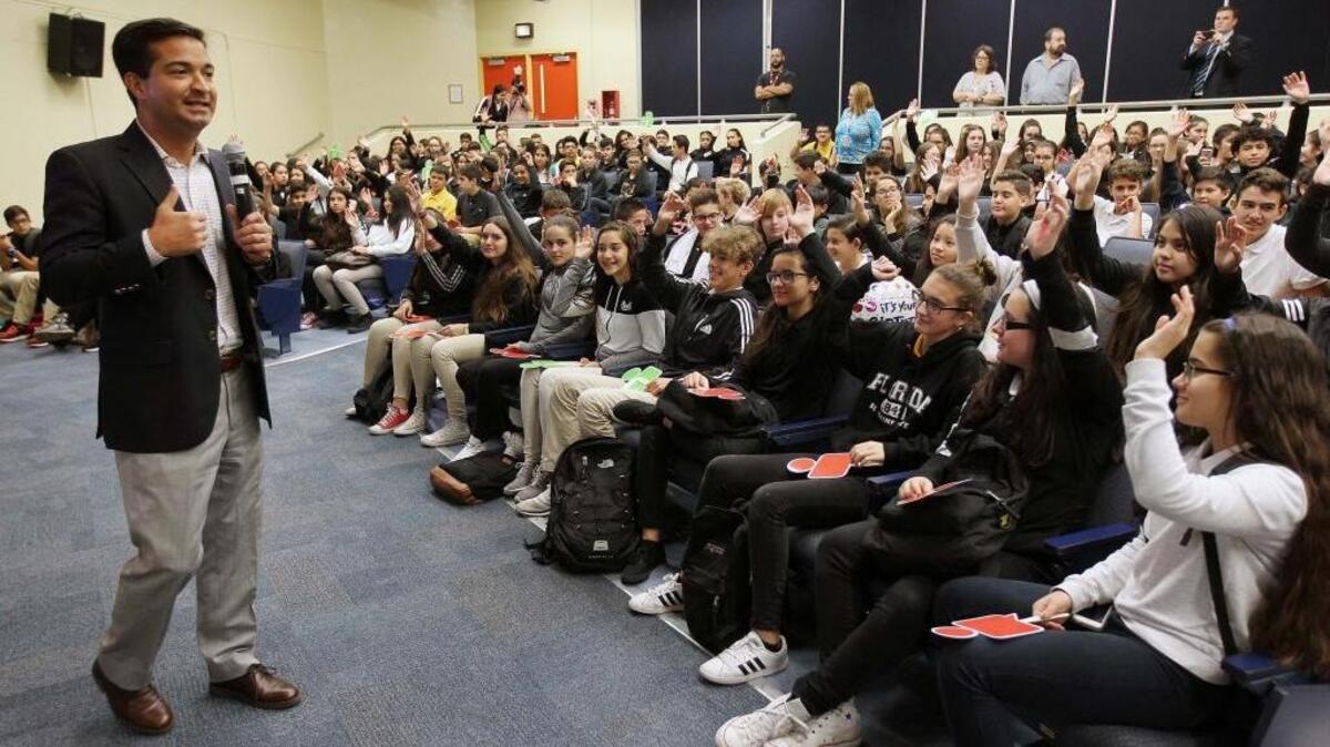 Overview of students during a visit by Google representatives and Miami Republican Rep. Carlos Curbelo (left) at W.R. Thomas Middle School to educate young people about how to avoid the dangers of social networking on the internet.