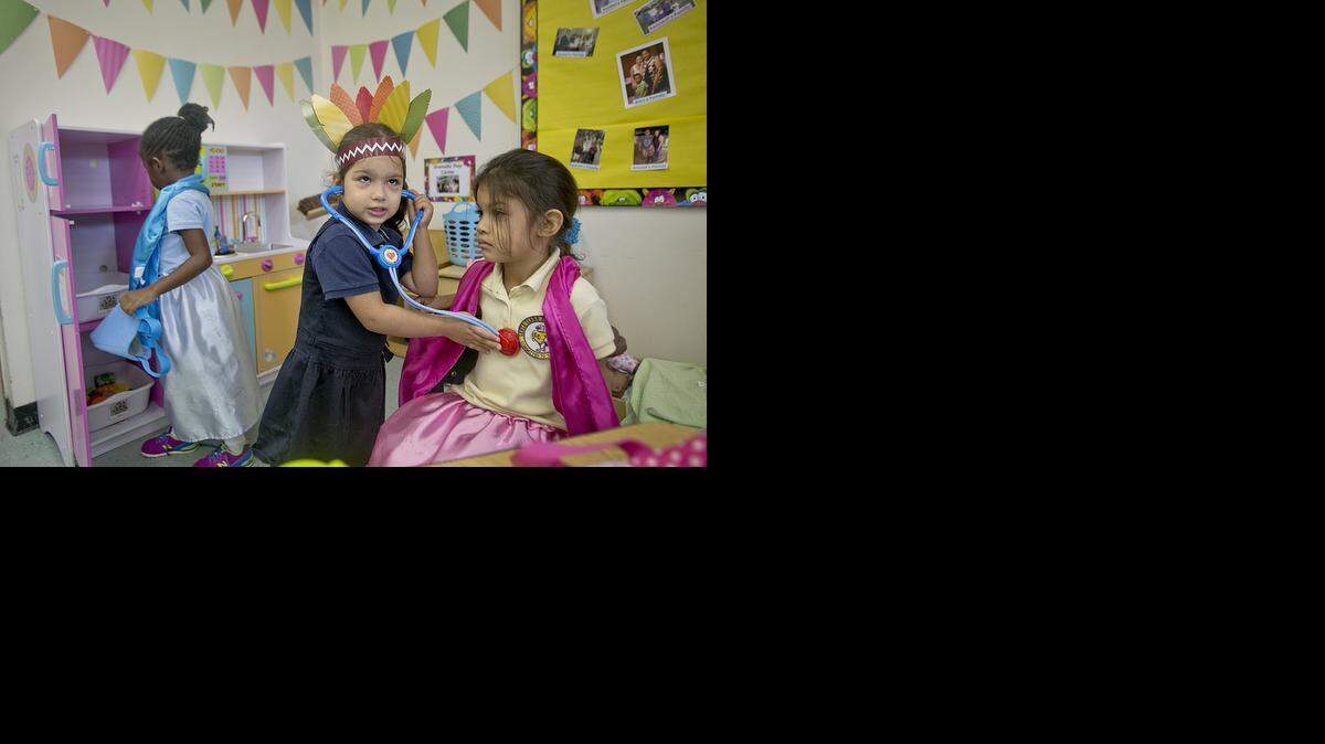 
Janelli Estopinan, 4, uses a toy stethoscope on classmate Sara Espinoza, 5, as Kennedi Spigner, 4, plays in the new kitchen in Leslie Walker's pre-K class at Santa Clara Elementary School. Walker used crowd-funding to help pay for the kitchen.


