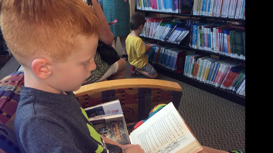 
Hunter Bosworth, 8, reads an Encyclopedia Brown book at the summer reading kick-off party Sunday at the Alvin Sherman Library, Research and Information Technology Center.
