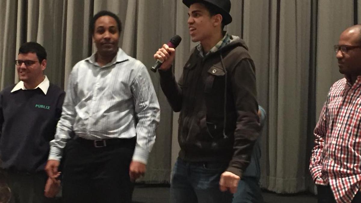 Student Bryan Tomlinson shares his thanks for the baking program after the movie premiere Wednesday at the Bill Cosford Cinema at University of Miami.