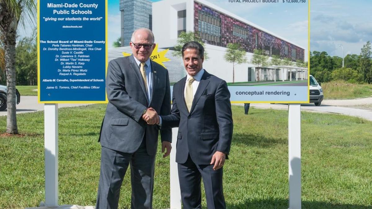 Florida International University President Mark Rosenberg and Miami-Dade Schools Superintendent Alberto Carvalho in front of a rendering for the new MAST@FIU center.
