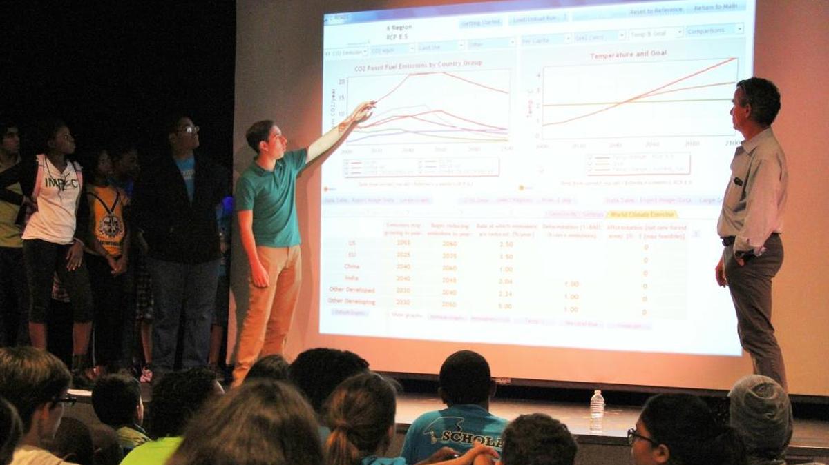 Team China explains how they plan to reduce CO2 emissions during a mock UN climate summit held at the former Frost Museum of Science in Coral Gables. “Before this workshop I put a lot of the blame on China but I didn’t really think about how the U.S. is relying on them,” said Brianna Cineus, 16, a junior at William H. Turner Technical High School.