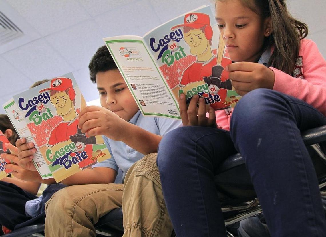 Fourth-grade students read at Kensington Park Elementary in Miami on May 10, 2016. The federal tax overhaul could impact the amount of money available for public education.