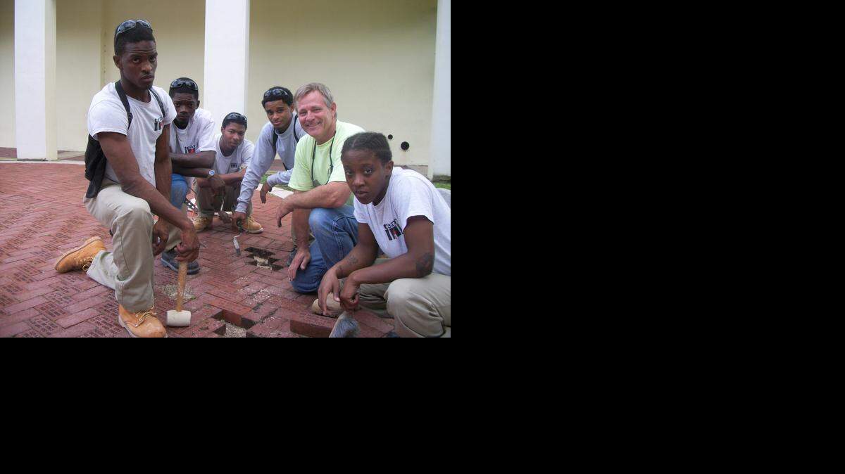 
VETERAN’S MEMORIAL: Masonry students from Homestead Job Corps Center laid 24 engraved bricks at the Veteran’s Memorial at Losner Park in Homestead. Instructor Terry Devine laid bricks with his students to remember those who served the country. From left to right are: Terrance Tyler, Rodney Winn, Dexter Tatum, Kristopher Moreno, Terry Devine and Christina Walker. 
