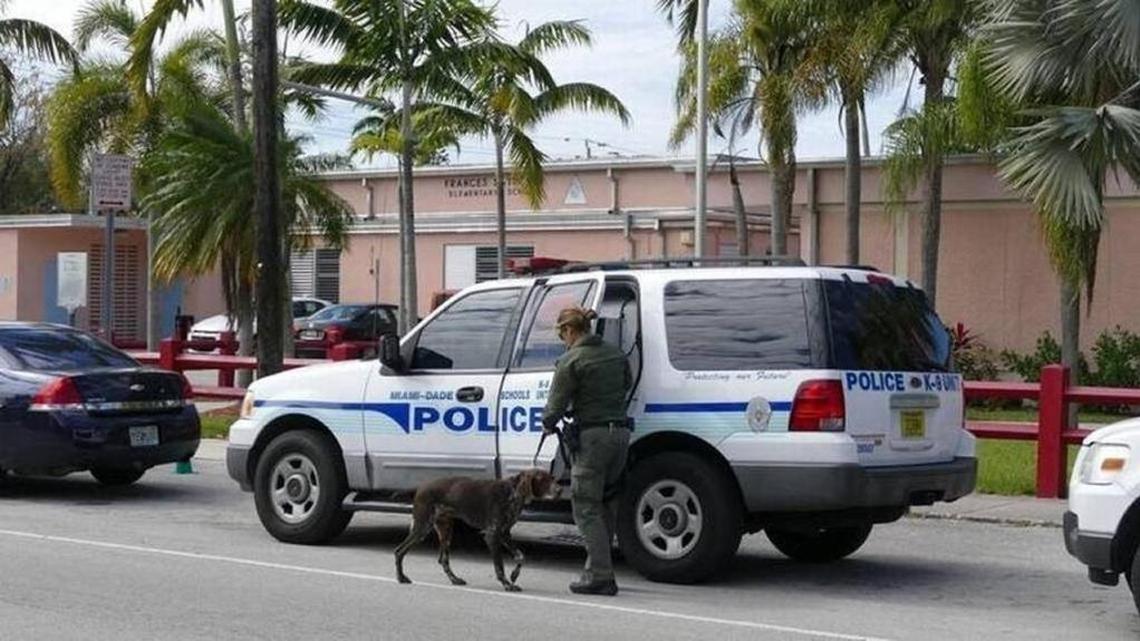 A Miami-Dade Schools Police K-9 unit responds to an incident at Frances S. Tucker Elementary School in February 2016. The school district plans to hire 20 additional schools police officers to increase security on its campuses following the Parkland shooting.