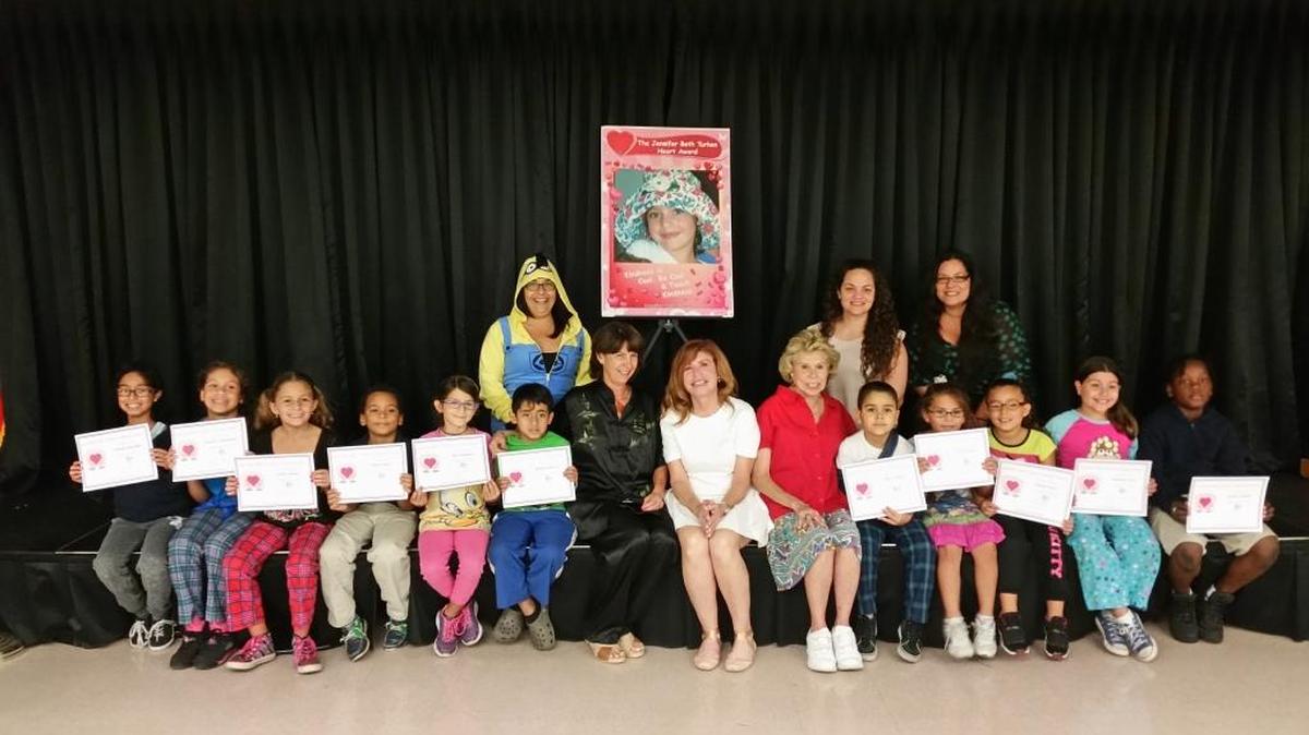 Michelle Chinchilla, Annalise Maldonado, Emily Molinet, Dionel Gomez, Mia Fernandez, Michael Gutierrez, Myles Daguer, Katie Martinez, Alaine Incera, Marianne Iriza and Jemiah Termilu were winners of the Jennifer Beth Turken Heart Award for their acts of kindness towards their peers. Students are pictured with Dana Turken, Clarie Warren and Principal Maria Costa.