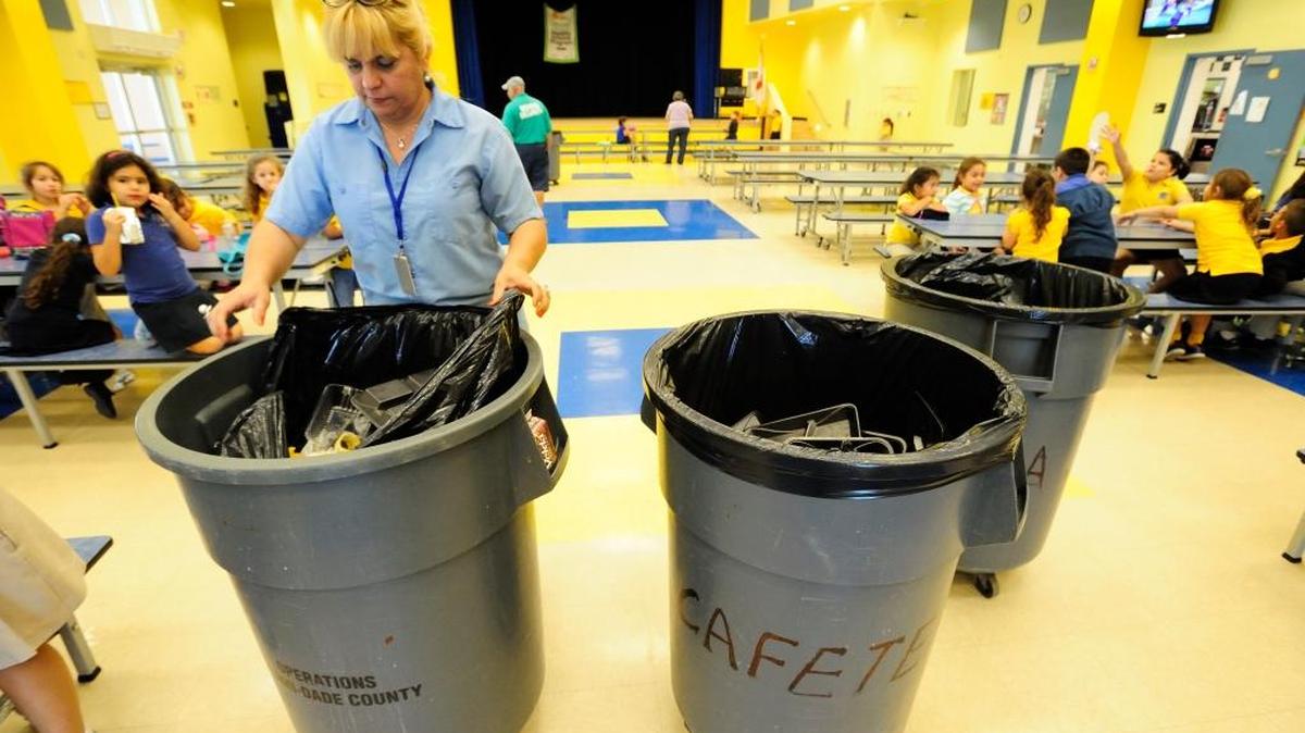 The Miami-Dade School Board voted to evaluate its policies for assigning custodians to schools after complaints from janitors who say they need additional help to keep schools clean. In this file photo from 2011, custodian Dory Uncal of North Hialeah Elementary helps keep the cafeteria clean.