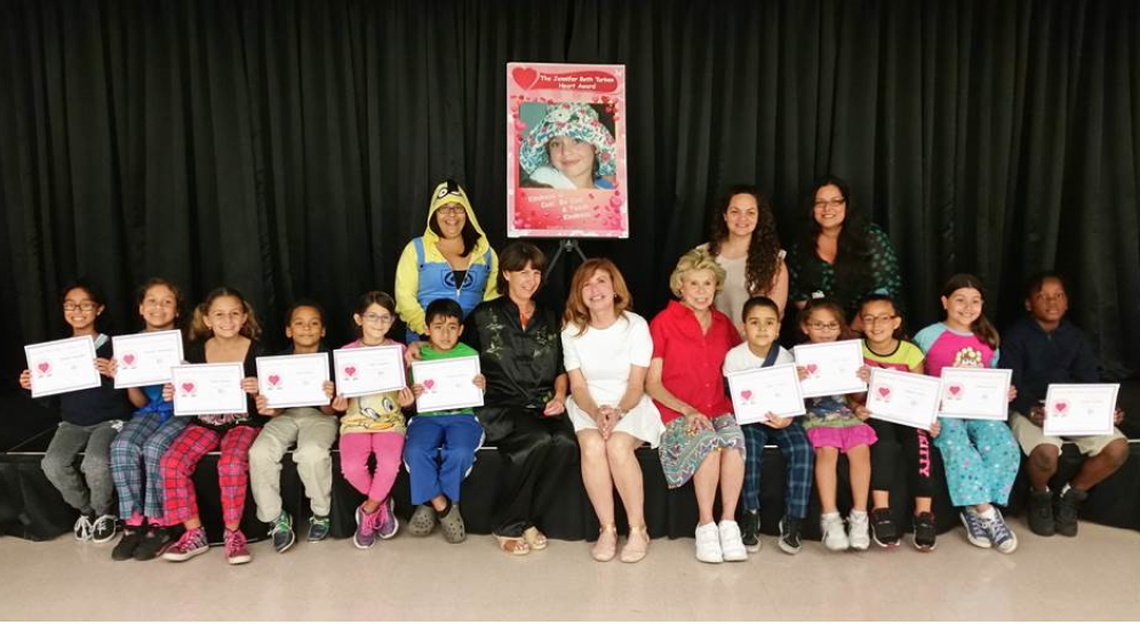 Select students of Fienberg-Fisher K-8 Center were winners of the Jennifer Beth Turken Heart Award for showing kindness towards their peers. Students are pictured with Assistant Principal Aisha Marrero, Instructor Yessenia Cardoso, Instructor Catherine Merced, Principal Maria Costa, Jennifer Turken’s mother, Dana Turken, and Jennifer Turken’s Grandmother, Claire Warren.