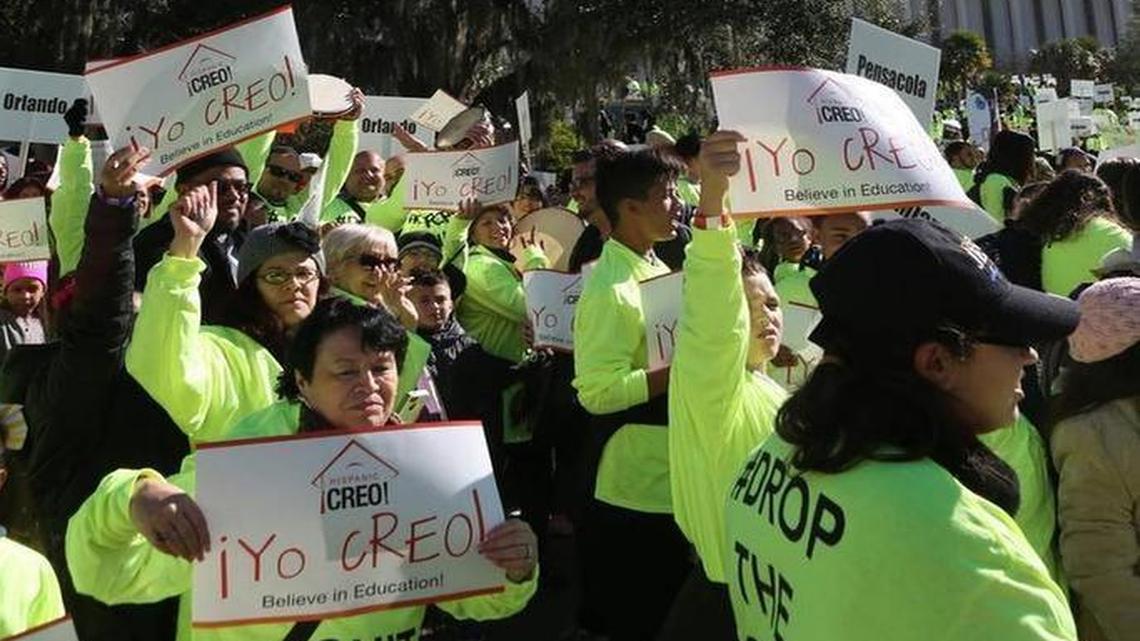 Demonstrators march on the Florida Capitol as they rally in support of the school voucher program Jan. 19, 2016.