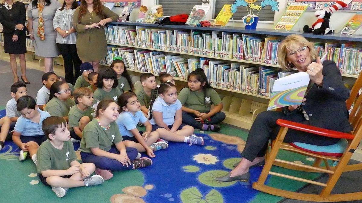U.S. Secretary of Education Betsy DeVos reads Dr. Seuss to kindergarten students at Royal Palm Elementary in Miami on Friday, April 7, 2017.