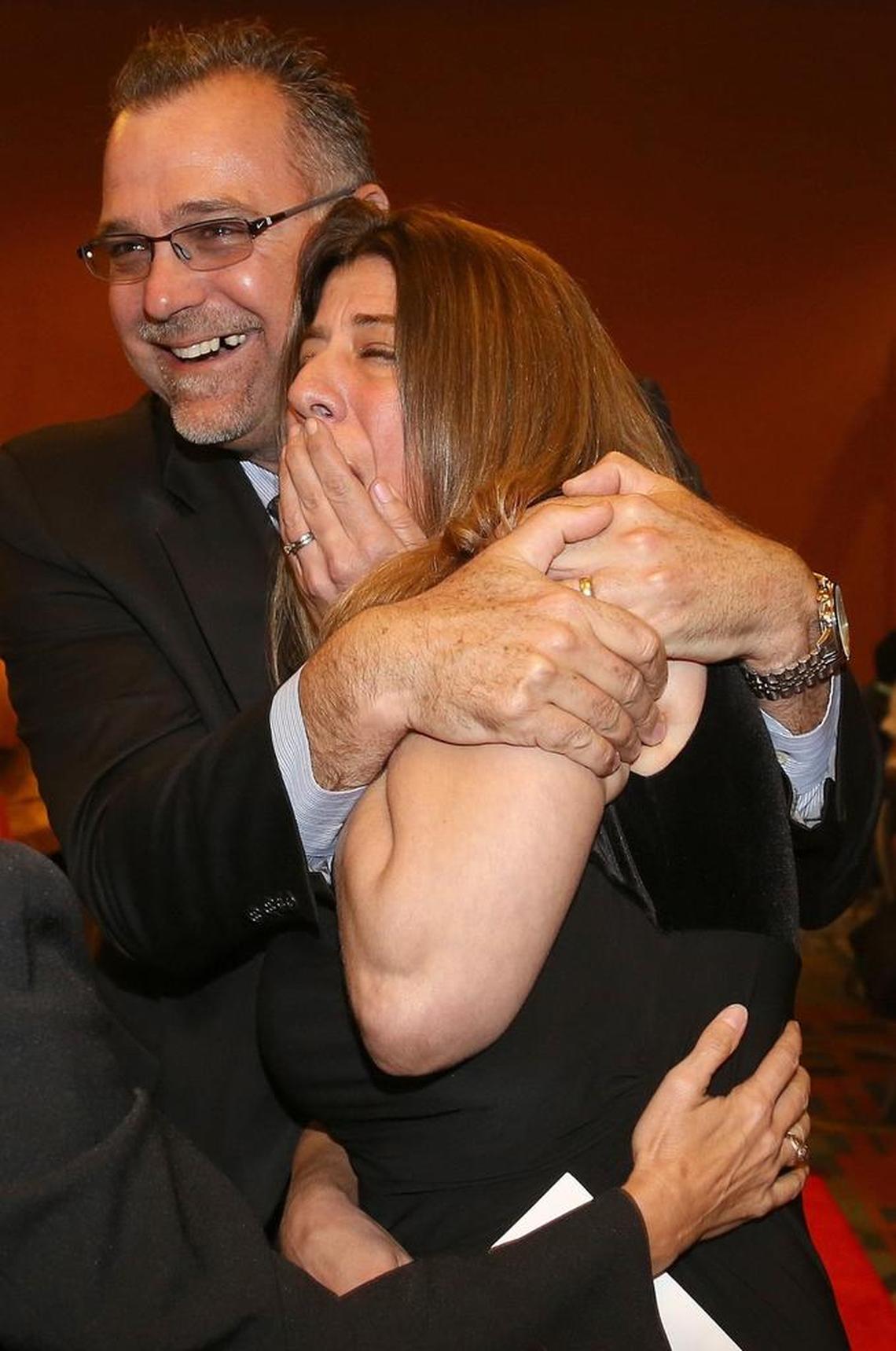 Molly Winters Diallo, of Alonzo and Tracy Mourning Senior High School, reacts and gets a hug from her principal, Chris Shinn, after being chosen Miami-Dade County Teacher of the Year 2019 at the Miami Airport and Convention Center in Miami, Florida.