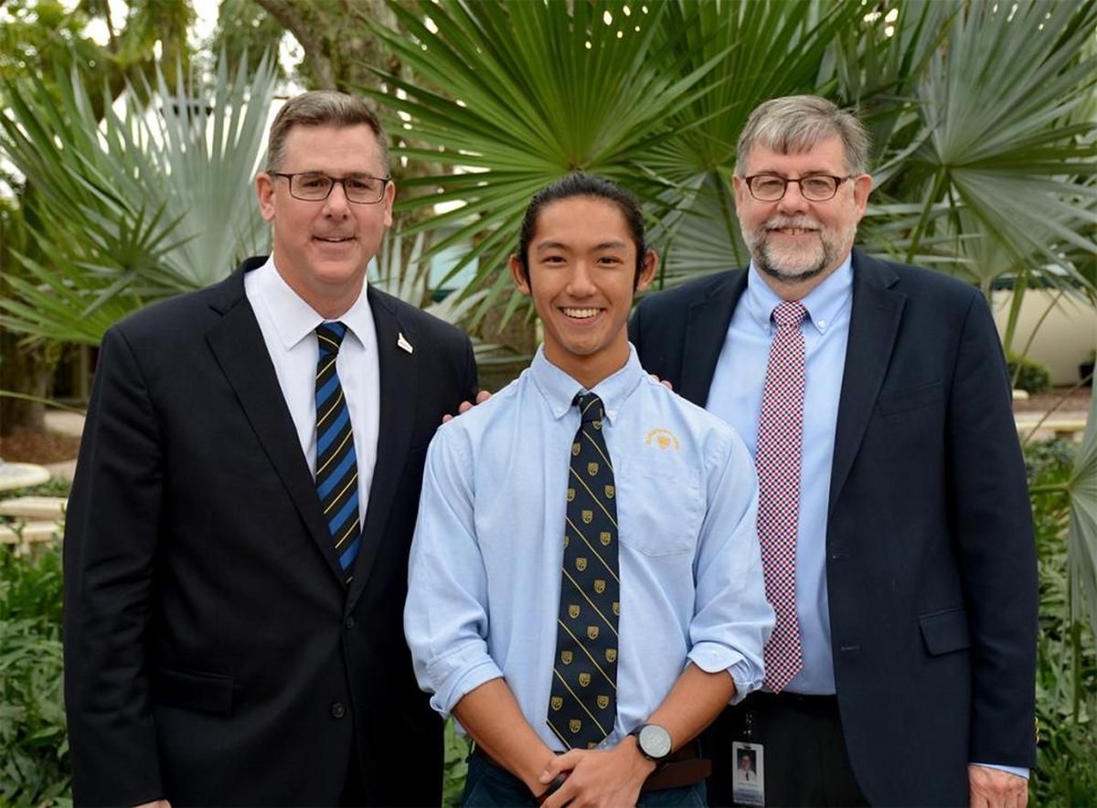 Duncan Stoner, center, of Palmer Trinity School recently was appointed to the U.S. Naval Academy. He is pictured with Head of School Patrick Roberts, left, and Head of Upper School Ashley Chapman.