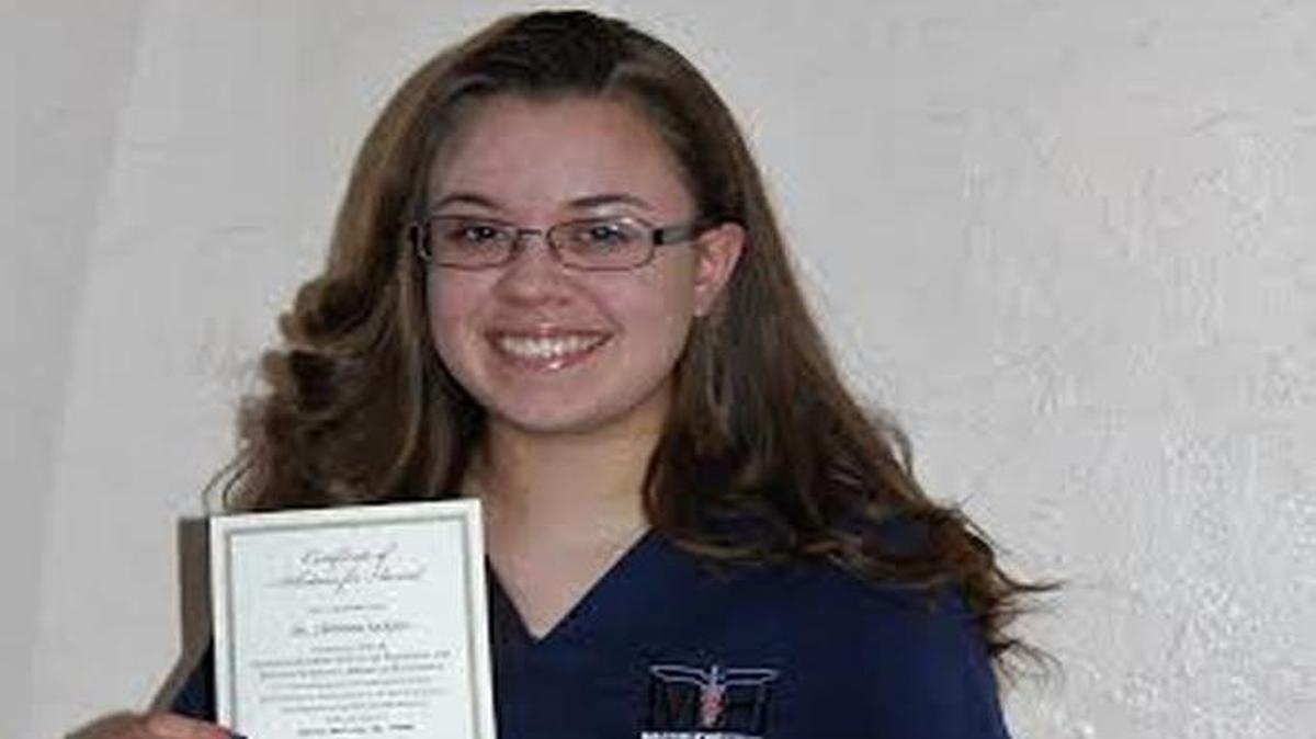 Christina Jackson, a 15-year-old Mast Academy Homestead junior, holds her nomination for the National Academy of Future Medical Leaders Academic Award of Excellence.