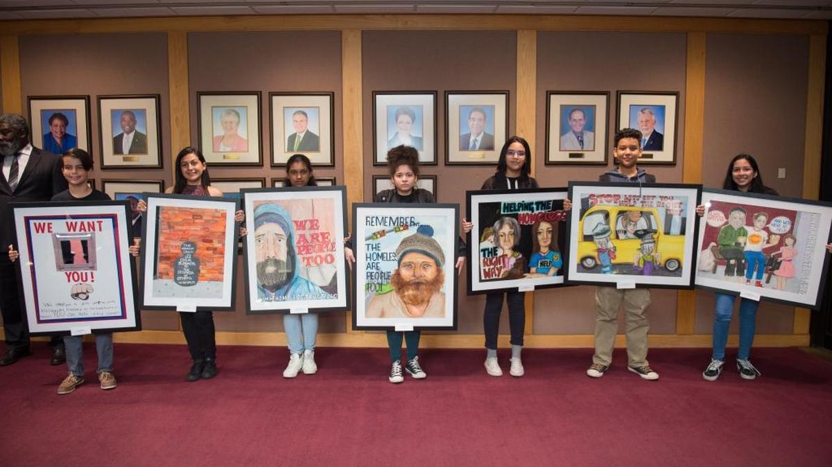 The Miami-Dade County Homeless Trust honored the winners, runner-ups, and honorable mentions of the 2017 Homeless Awareness and Sensitivity Poster and Essay Contest. The honorees, pictured from left to right, are Felix Fernandez, Aileen Hernaiz, Sarialis Gonzalez, Gretsy Moreno, Gabriela Marcano, Jesus Bracamonte, and Kaylee Hawkins.