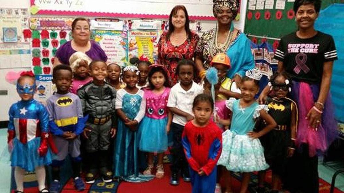 Miami-Dade School Board’s Vice Chair Dorothy Bendross-Mindingall joined Lorah Park Elementary Principal Maria Lacavalla, center, and teachers to read to students during Character Day.
