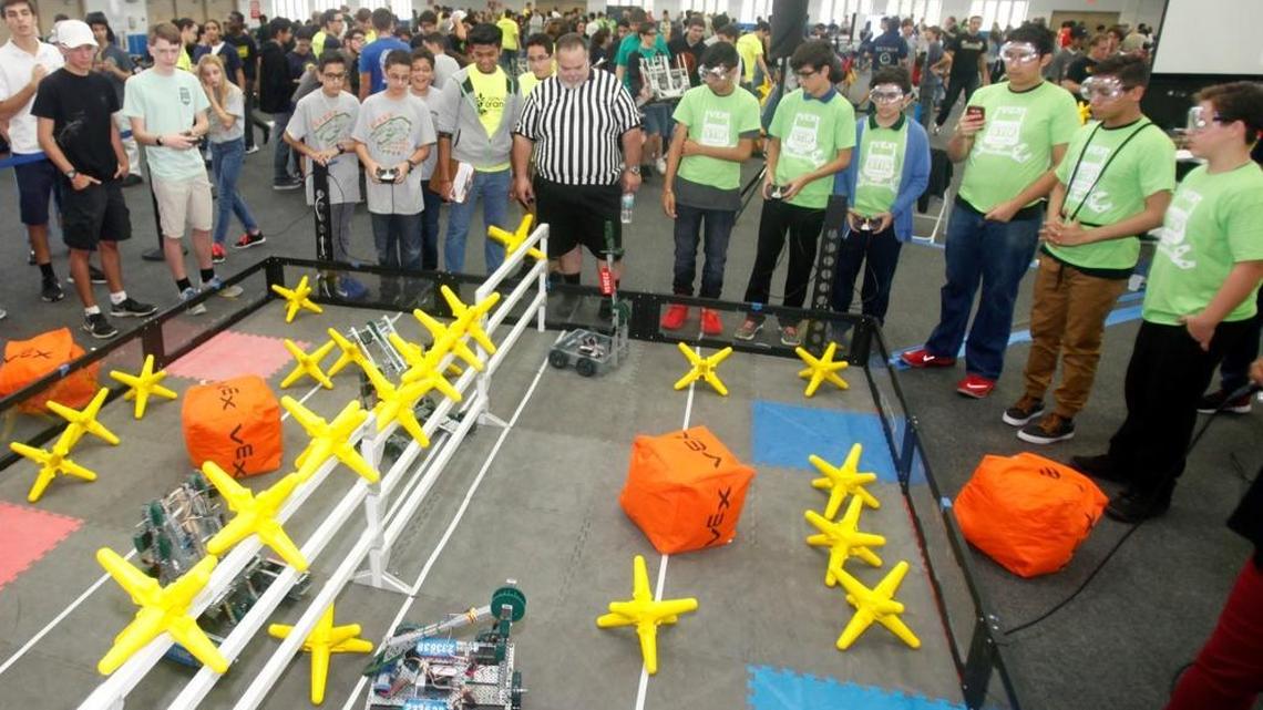 Seventh-graders on two teams -- PPMH Lords, left, from Pinecrest Preparatory Middle-High School in Miami, and Roborams from Riveria Middle School in Miami, take part in a qualifying round at the Junior Orange Bowl VEX Qualifier Robotics Competition on Saturday, Nov. 5, 2016. Roborams won the round. Miami-Dade County's largest robotics competition brought more than 100 teams to the Miami Springs Recreation Center. Teams represented home-school, public, private and charter school education. Top winners of the competiton will advance to state championships and possibly the national championship.