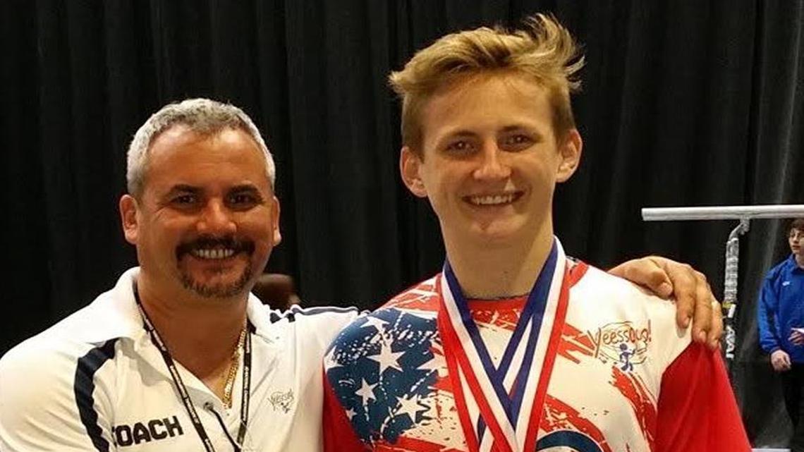 
Olympic coach Yin Alvarez congratulates Tyler Harriman on winning a third- and sixth- place medal at the 2015 Nationals. Attending “virtual” school in Miami-Dade enables him him to spend his days training at the gym.
