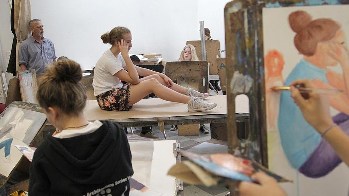 Laura Sanchez, center, poses for fellow students at Miami-Dade's prestigious Design and Architecture Senior High. The school is one of four in the district to place in the top 50 on the annual U.S. News and World Report rankings.