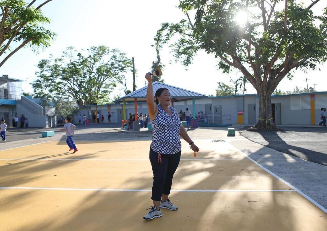 Maintenance employee Iris Garcia ringing a hand-held bell at the Julio Selles Sola Elementary School in Rio Piedras a neighborhood of San Juan, Puerto Rico, on Tuesday, October 24, 2017.