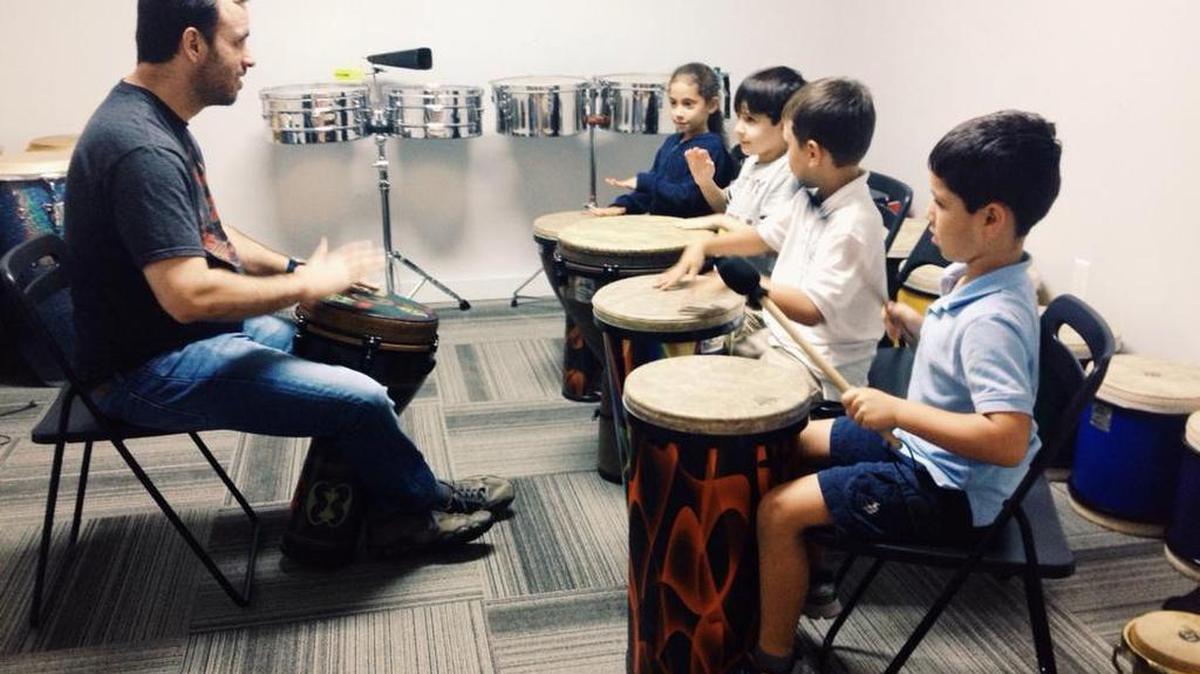 Brandon Cruz, founder and director of the South Florida Center for Percussive Arts, teaches a hand drumming class.