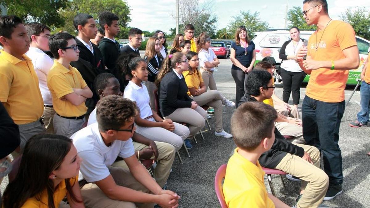 Orchid Lab research assistant Jay Arce talks with seventh-grade students during an event with The National Fish and Wildlife Foundation and Wells Fargo at Rockway Middle School on Tuesday Nov. 1, 2016.