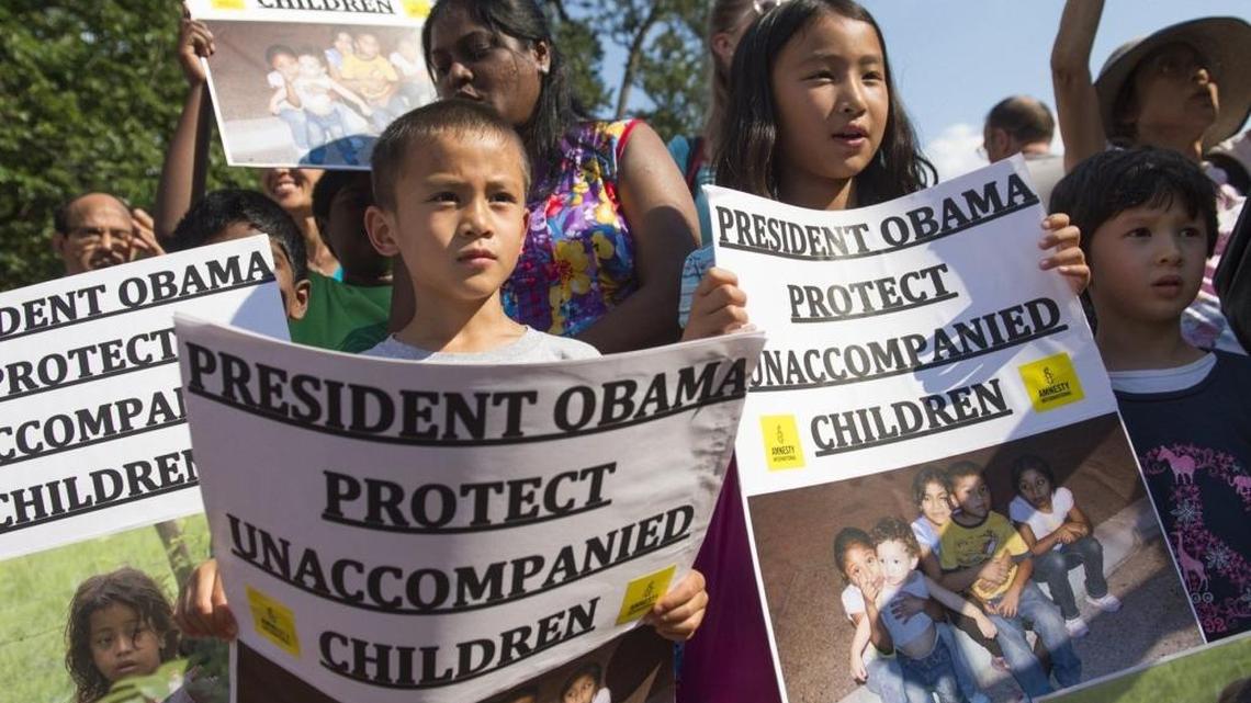 This July 17, 2014 file photo shows young demonstrators with the groups Amnesty International and We Belong Together as they protest in favor of keeping unaccompanied children who entered the U.S. illegally in the country.