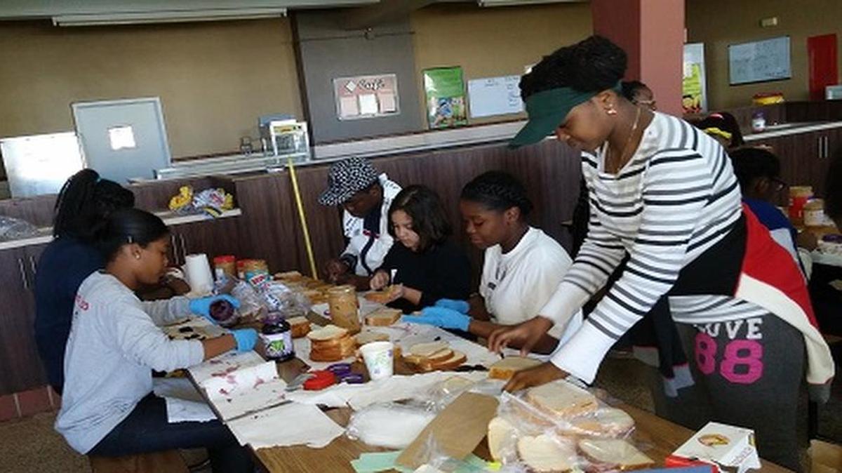 Archbishop Curley Notre Dame Preparatory students fast for 27 hours while packing and delivering about 3,638 bagged lunches for Miami’s homeless. From left: Amanda Lesperence, Liz Jean-Jacques, Styve MBuyi, Camila Egan, volunteer, Sabrina Monestime and Marie Etienne.
