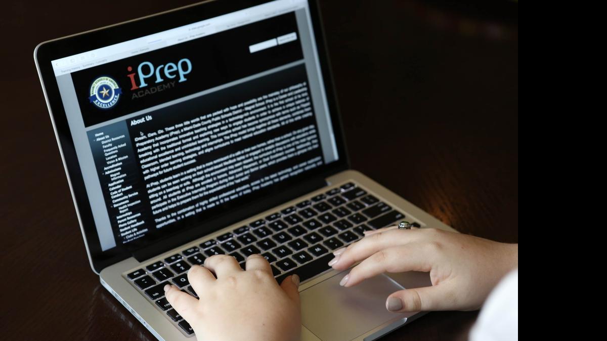 
At Miami-Dade’s iPrep, students use school-issued laptops and a blend of online lessons in a technology-rich environment.

