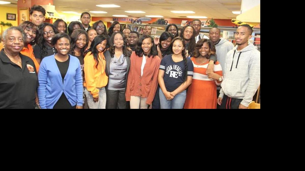 SCHOLARSHIP WINNERS: Roberta Daniels, president of the Alumni Association, Laura Jones, scholarship committee chair, and Laura Jones, co-chair, stand with the recent scholarship recipients from Booker T. Washington High School.