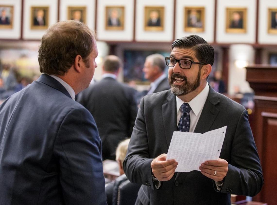 Rep. Manny Diaz Jr., R-Hialeah, right, talks with Rep. Jayer Williamson, R-Pace, on the floor of the House during a special session of the Florida legislature Thursday June 8, 2017, at the Capitol in Tallahassee.