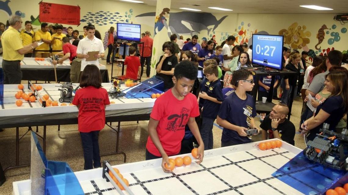 Caiden Clayton, 12, who lives in Miami Gardens and is in sixth grade at Howard D. McMillan Middle School, lines up plastic balls for the next match of the VEX IQ Challenge, presented by the Robotics Education & Competition Foundation on Saturday, Nov. 7, 2015 at Citrus Grove Middle School in Miami.