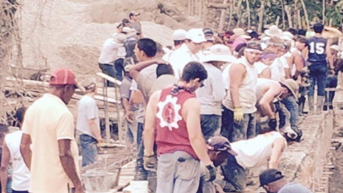 
Belen Jesuit students work side by side with villagers of El Puerto in the Dominican Republic to build a bridge that will allow students easy access to schools in the neighboring villages.
