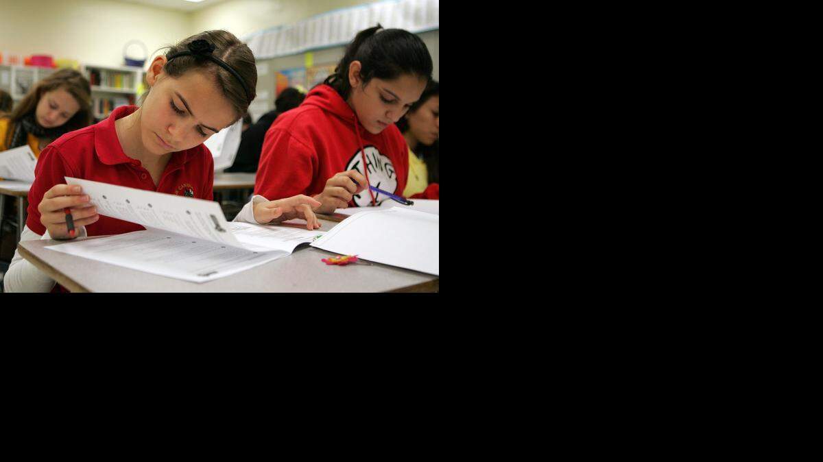 
Language arts students at Carver Middle School in Miami-Dade County prepare for the state assessments. Across Florida, parents are pushing back on standardized tests. Some say schoolchildren are taking too many exams. Others have concerns about the quality of the tests, and the way the results are being used.
