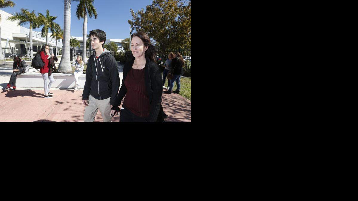 
Parent Kayla Rynor, with her 15-year-old son Jack, a student at Miami Beach High, is opposed the 'choice' designation that has allowed larger classes at the high school and all of Miami-Dade public schools.
