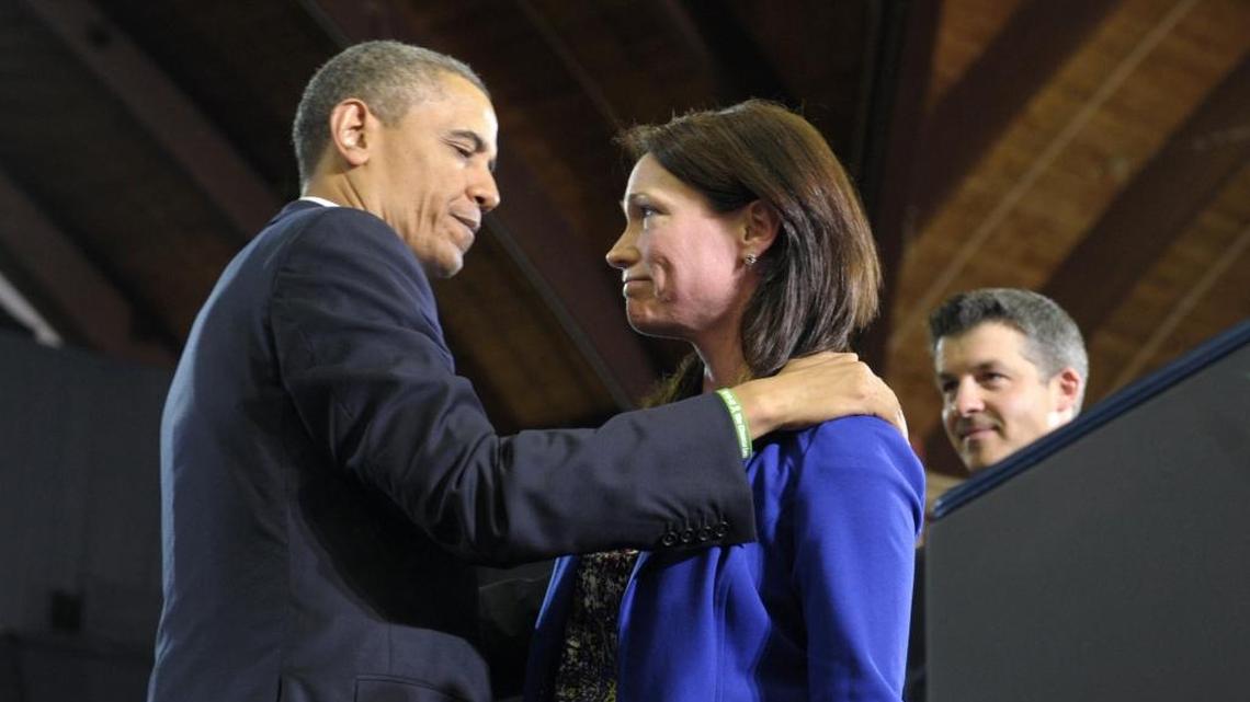 
President Barack Obama looks at Nicole Hockley and her husband Ian, right, after she introduced him at the University of Hartford in Hartford, Conn., Monday, April 8, 2013. The Hockley's lost a child in the school shooting at Sandy Hook Elementary School in Newton, Conn. On Wednesday, Hockley is scheduled to speak at the Miami-Dade County School Board to encourage Florida’s largest school system to adopt the organization’s training and prevention programs.


