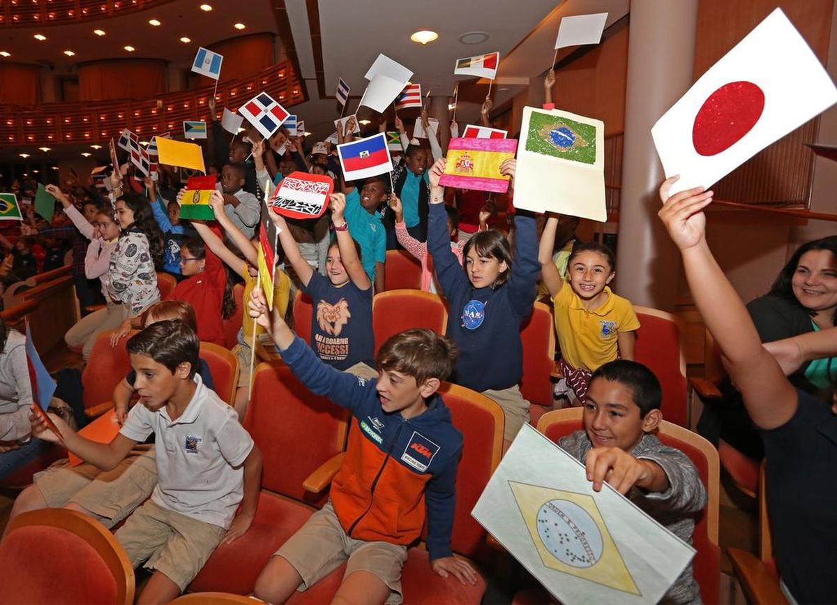 School children from Ada Merritt K-8 Center hold up flags from various countries as Gina Rodriguez, the voice of animated character Carmen Sandiego, hosts a live-action game show at the Arsht Center’s Knight Concert Hall. 1,700 Miami-Dade County public school kids attended the event to celebrate the relaunch of the show on Tuesday, January 8, 2019.