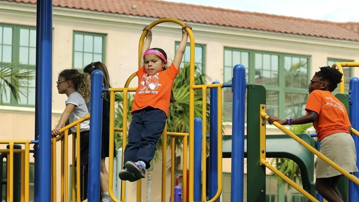 Kristen Bachmann, 6, swings on the equipment during recess at North Beach Elementary's Jennifer Beth Turken Playground earlier this year.