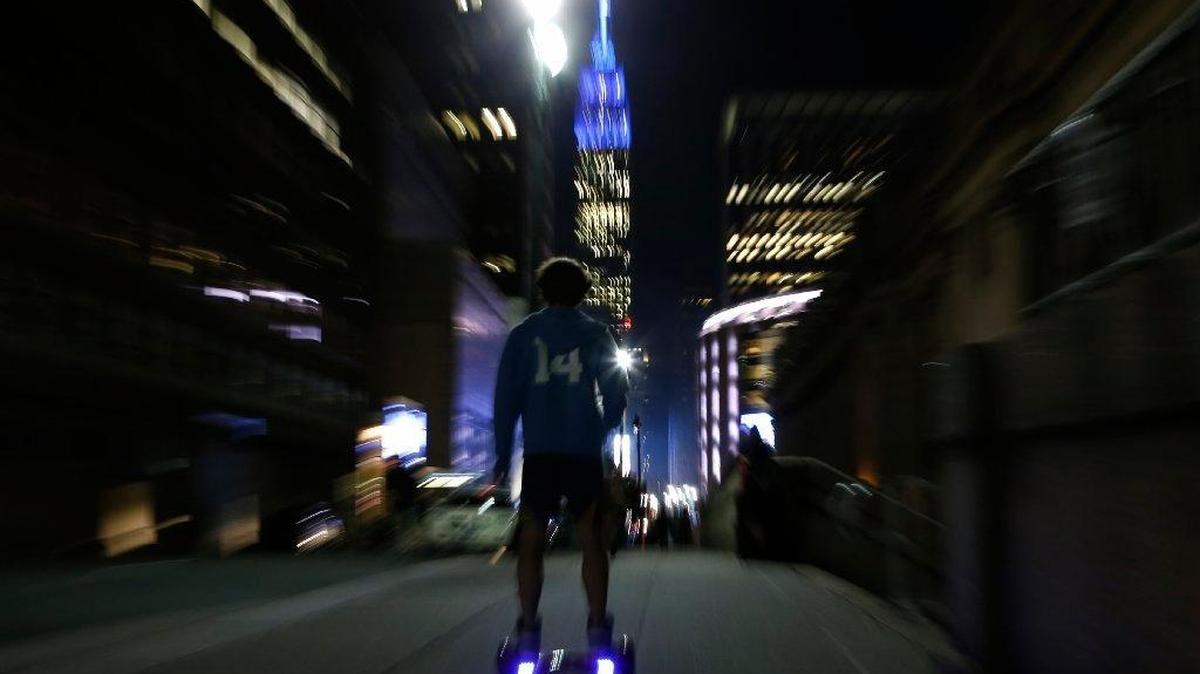 In this Oct. 21, 2015 file photo, a young man rides a hoverboard down a Manhattan street toward the Empire State Building in New York. The U.S. Consumer Product Safety Commission said the Friday, Feb. 19, 2016 that the hoverboards can be a fire hazard and will go after companies that make, sell, import or distribute hoverboards that don’t meet safety standards.