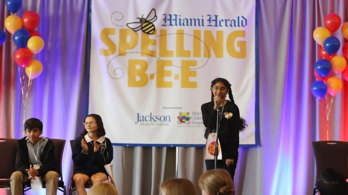Second-place contestant Kyler Pace and third-place contestant Lauren Garcia-Stille clap as Vasundara Govindarajan,13, wins the the Miami Herald Spelling Bee for Miami-Dade and Monroe County students at Jungle Island, March 7, 2017, for her second year in a row. Govindarajan won the Bee by spelling the word, boiserie. Govindarajan attends Archimedean Middle Conservatory.