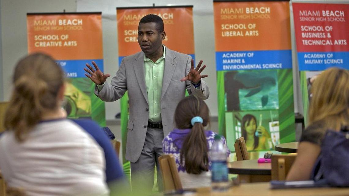 Monaud Daphnis, financial aid director at Miami Dade College Wolfson Campus, talks to parents and students about the FAFSA (Free Application for Federal Student Aid) at Miami Beach Senior High during a meetng this week.