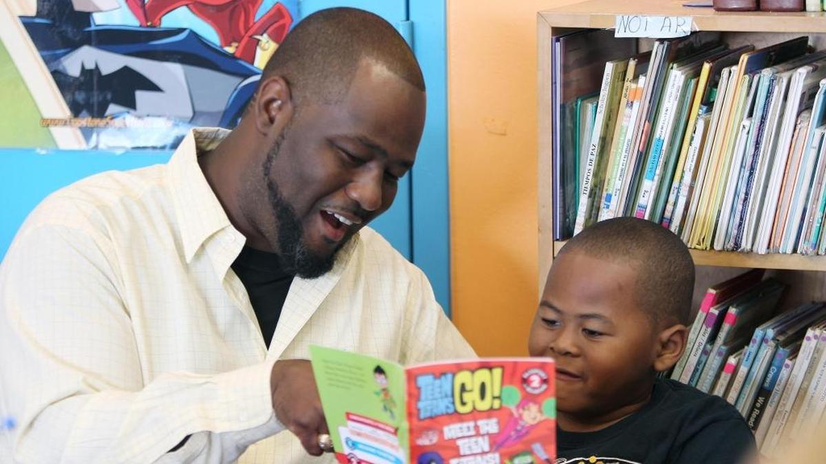 Samuel Wims Jr. and his son Samuel Wims III during Fathers in Education Day at Kelsey L. Pharr Elementary School in May.