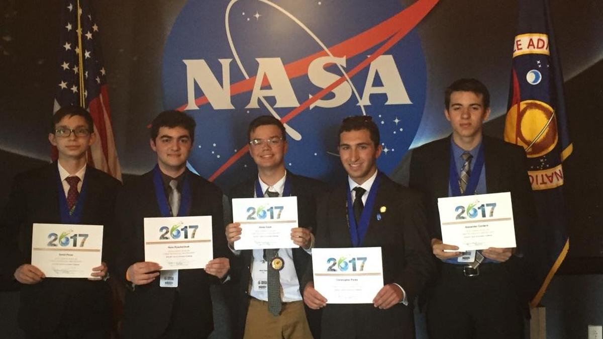 David Perez, Hans Rueckschnat, Jesus Capo, Chris Perez, and Alexander Cordero of Christopher Columbus High School placed first in the Cybertechnology and Security category during the Conrad Innovation Challenge April 29 at the Kennedy Space Center in Titusville. The students, also named Team Tier, competed against high school teams from around the world, including China, Australia and India.